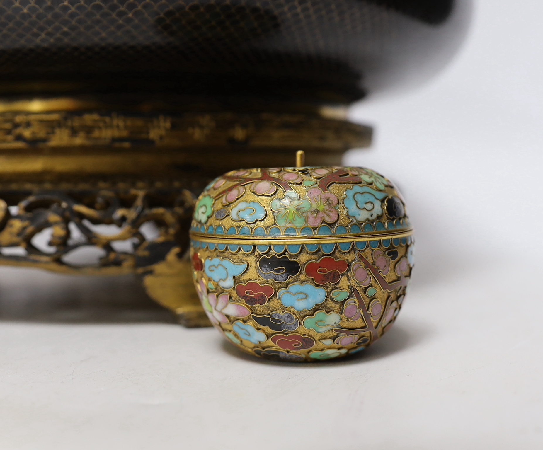 A Chinese cloisonné enamel bowl on partially giltwood stand together with two miniature enamelled pots, one in the form of an apple, largest 30cm diameter